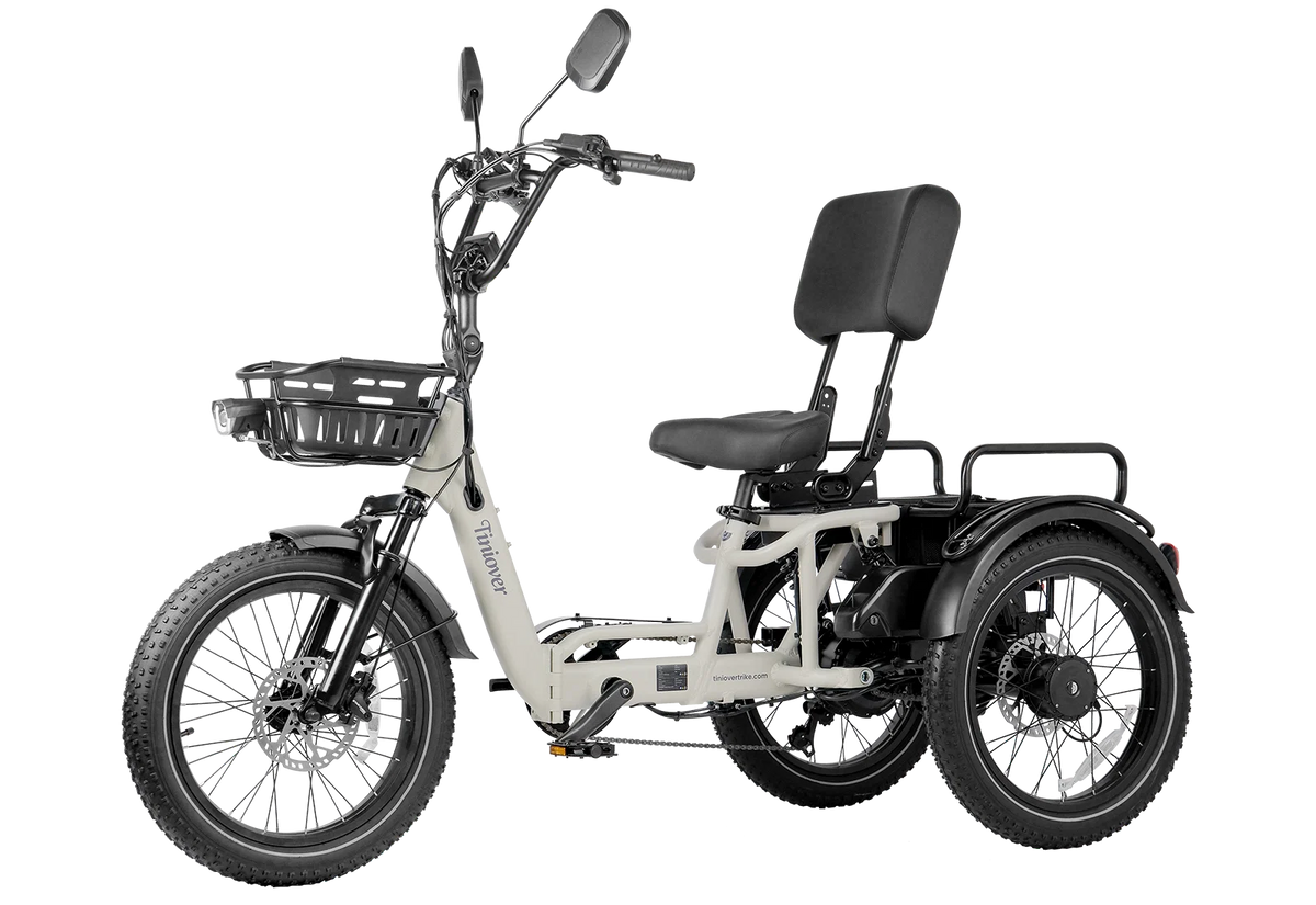 White Tiniover River electric trike side view on a transparent background, showing the semi-recumbent seat, backrest, front basket, front disc rotor, and rear motor