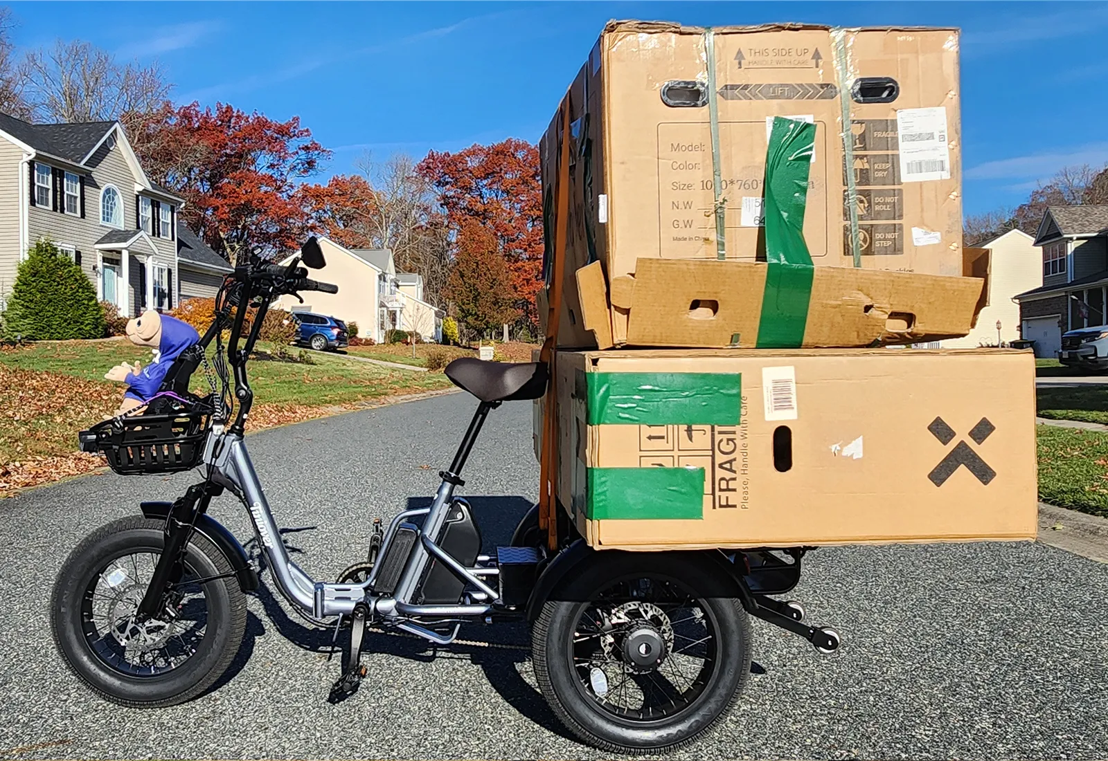 Tiniover Creek Pro electric cargo trike loaded with boxes on the rear rack