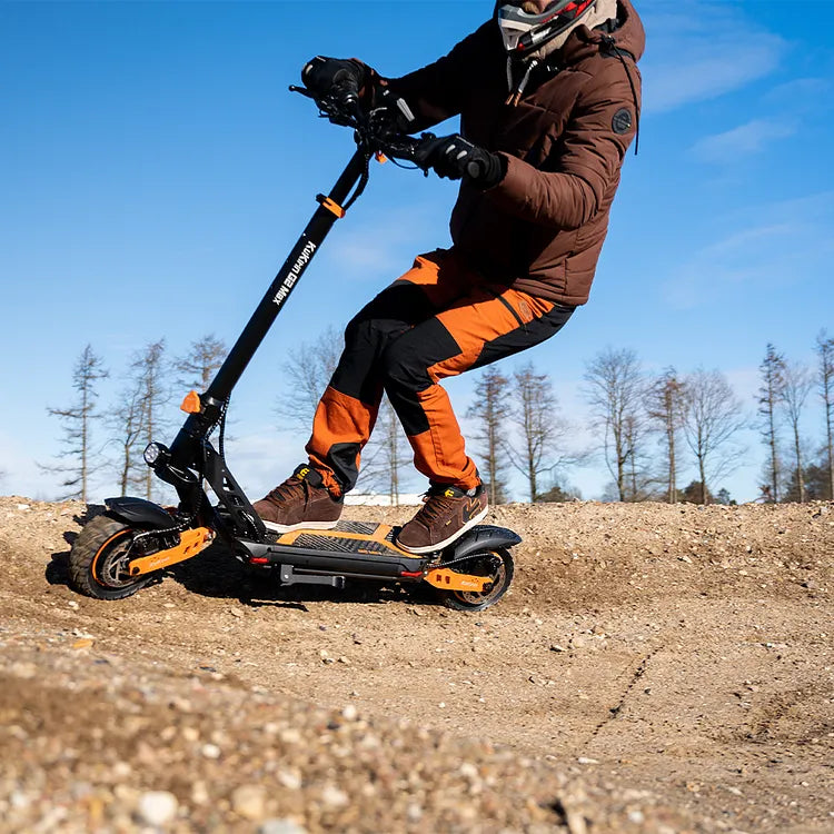 KuKirin G2 Max rider on unpaved terrain