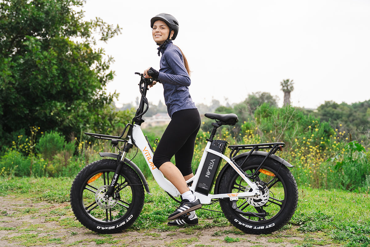 VITILAN U7 white electric bike showing step-through frame and rear rack