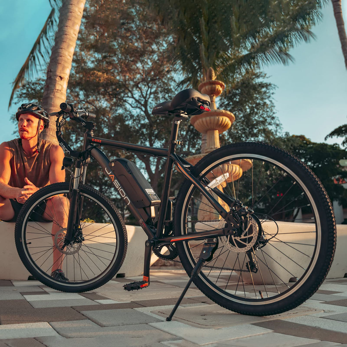 Jasion EB5 parked beside a city bike rack showing compact footprint