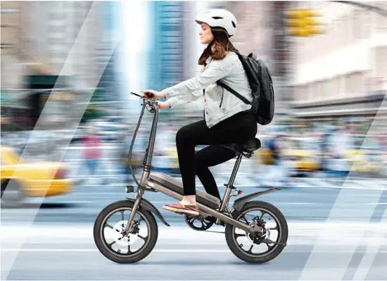 Smilee S5 in use on a city street — folding frame means the rider can carry it onto transit when the route ends