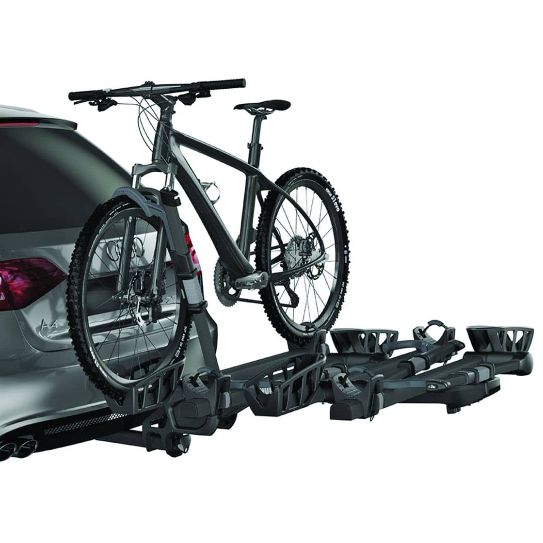 Thule T2 Pro XT add-on carrier in full — platform-style tray holds a third bike without touching the frame, compatible with the T2 Pro XT 2-bike base